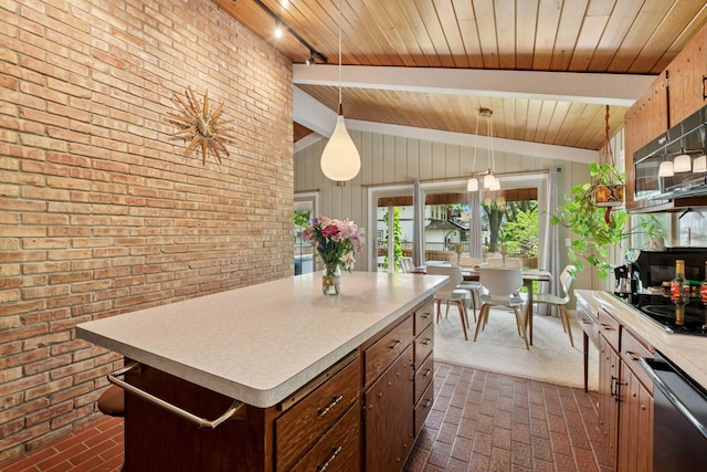kitchen with brick patterned floors, light countertops, black electric cooktop, wood ceiling, and a kitchen island