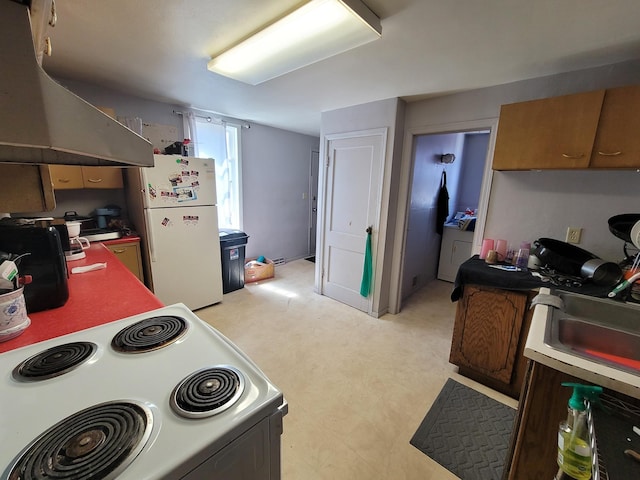 153 10th Ave N, Waite Park, MN 56387 - kitchen with washer / dryer, white appliances, light floors, extractor fan, and a sink