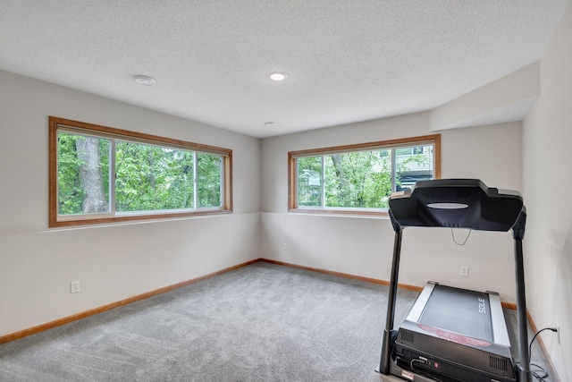 workout area with carpet floors, a textured ceiling, baseboards, and recessed lighting