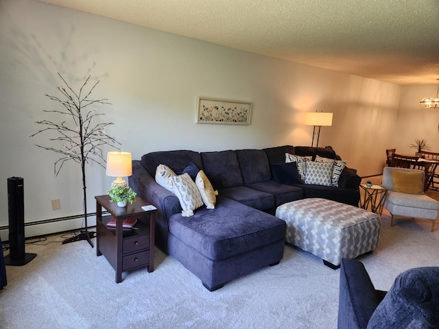 living room with carpet floors, a notable chandelier, and a baseboard heating unit