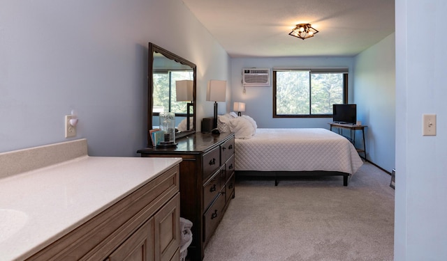 bedroom featuring multiple windows, light carpet, and a wall mounted AC