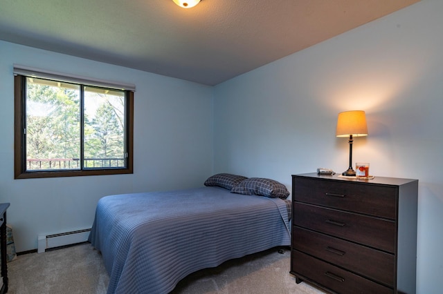 bedroom with baseboards, light carpet, and baseboard heating