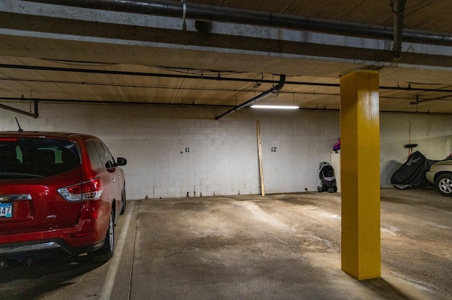 parking deck featuring concrete block wall