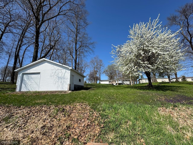 view of yard with an outbuilding and a garage