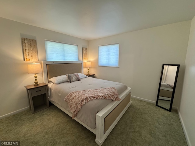 carpeted bedroom with baseboards