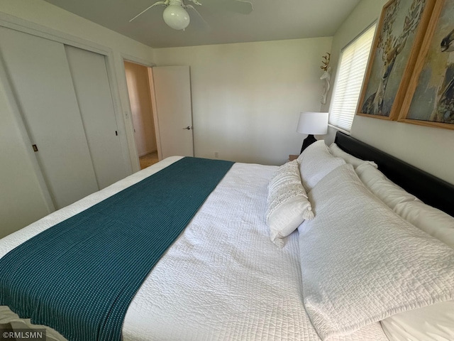 bedroom with a ceiling fan and a closet
