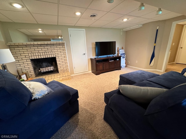 living area with recessed lighting, baseboards, carpet flooring, a paneled ceiling, and a fireplace