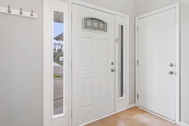 entryway featuring light tile patterned flooring