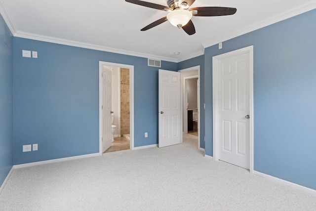 unfurnished bedroom with visible vents, ornamental molding, carpet, and baseboards