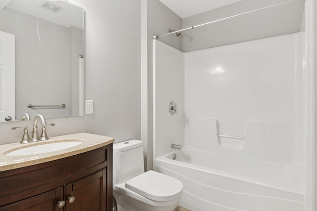 bathroom with toilet, visible vents, tub / shower combination, and vanity