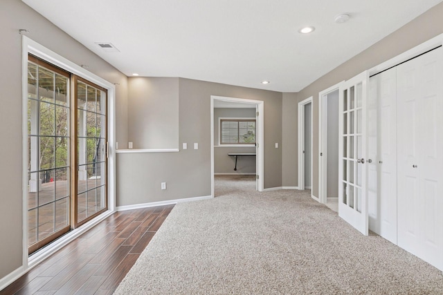 unfurnished room with french doors, visible vents, baseboards, dark wood-style floors, and recessed lighting