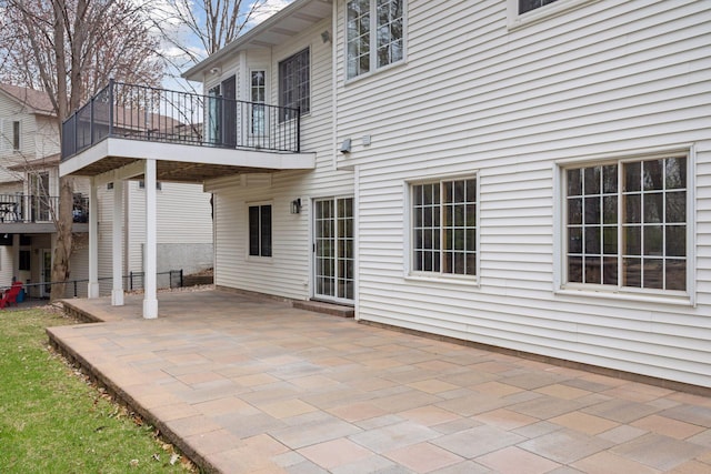 exterior space featuring a patio area and a balcony