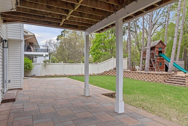 view of patio / terrace featuring a playground and a fenced backyard