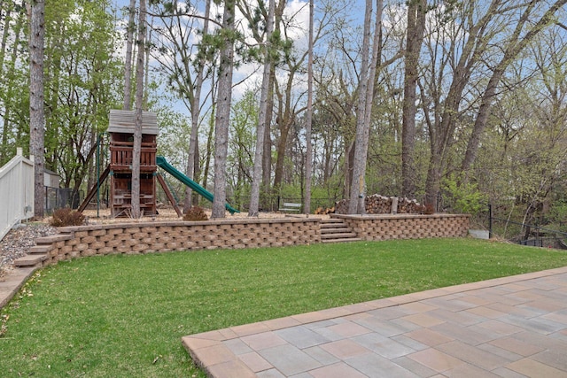 view of yard with a playground and fence