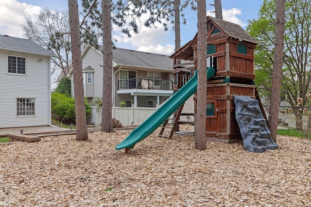 view of jungle gym featuring fence
