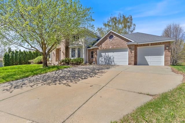 3088 Canyon Rd, Chaska, MN 55318 - view of front of home featuring concrete driveway, brick siding, a front lawn, and a garage