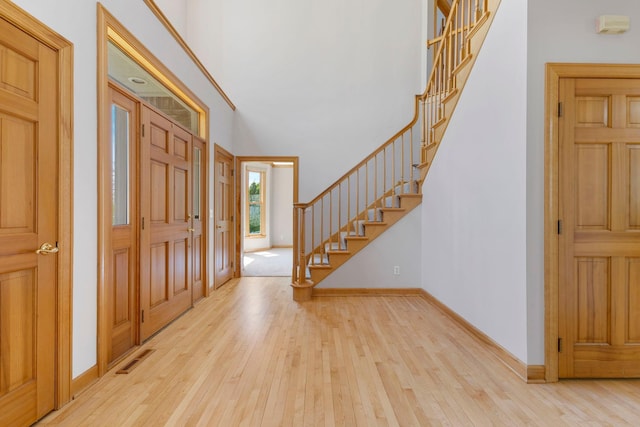 3088 Canyon Rd, Chaska, MN 55318 - foyer with baseboards, stairs, and hardwood / wood-style flooring