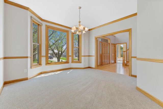 3088 Canyon Rd, Chaska, MN 55318 - empty room with carpet flooring, crown molding, a notable chandelier, and baseboards