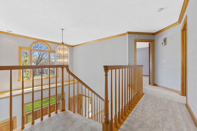3088 Canyon Rd, Chaska, MN 55318 - hall featuring crown molding, carpet floors, baseboards, an upstairs landing, and an inviting chandelier