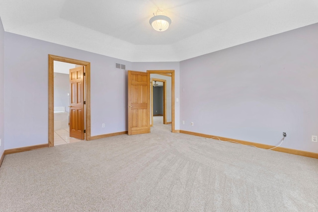 3088 Canyon Rd, Chaska, MN 55318 - unfurnished bedroom with baseboards, visible vents, light carpet, and ensuite bath