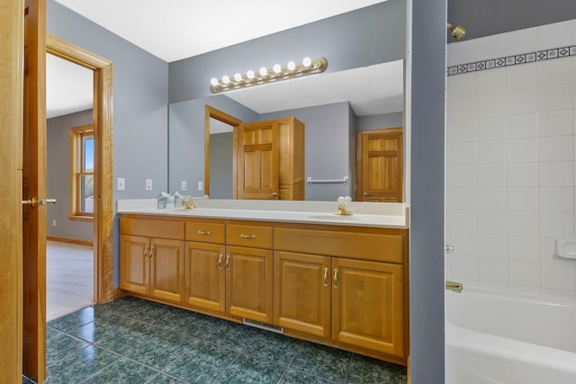 3088 Canyon Rd, Chaska, MN 55318 - full bathroom with visible vents, tile patterned flooring, double vanity,  shower combination, and a sink