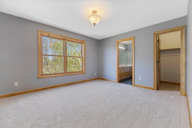 3088 Canyon Rd, Chaska, MN 55318 - unfurnished bedroom featuring baseboards, carpet, ensuite bathroom, and a spacious closet