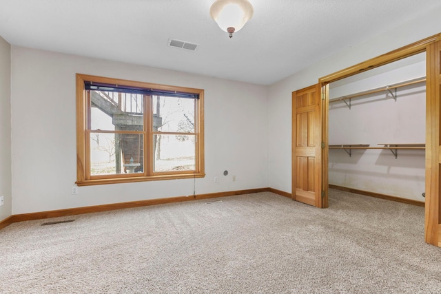 3088 Canyon Rd, Chaska, MN 55318 - unfurnished bedroom with visible vents, baseboards, carpet floors, and a closet