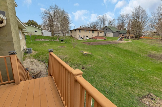 224 Spring St, Holdingford, MN 56340 - view of yard featuring central AC unit, a residential view, and a playground