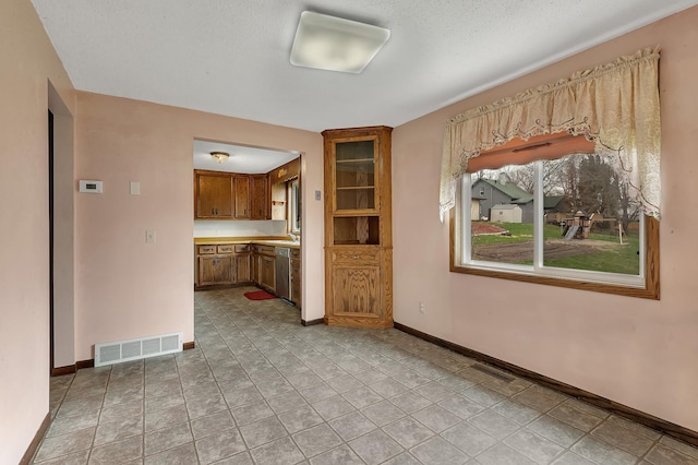 224 Spring St, Holdingford, MN 56340 - unfurnished living room with baseboards, visible vents, and a sink
