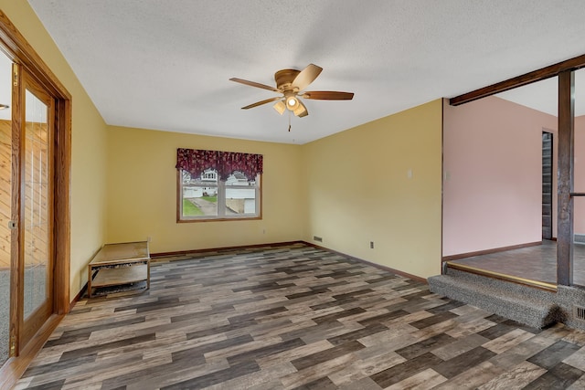 224 Spring St, Holdingford, MN 56340 - unfurnished room with ceiling fan, a textured ceiling, baseboards, and wood finished floors