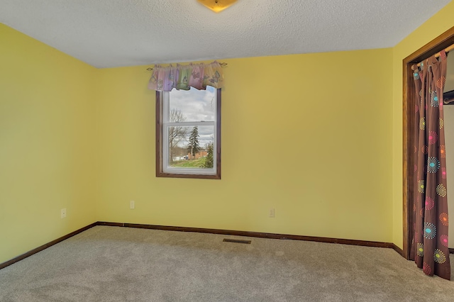 224 Spring St, Holdingford, MN 56340 - carpeted spare room featuring a textured ceiling, baseboards, and visible vents