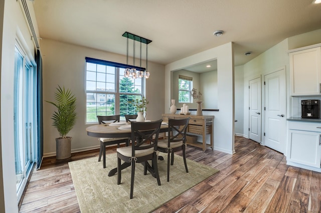 15637 Eddy Creek Way, Apple Valley, MN 55124 - dining area featuring light wood-style floors and baseboards