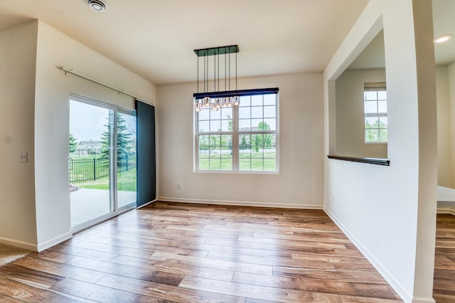 15637 Eddy Creek Way, Apple Valley, MN 55124 - spare room with healthy amount of natural light, hardwood / wood-style flooring, and baseboards