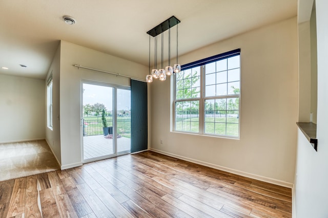 15637 Eddy Creek Way, Apple Valley, MN 55124 - empty room featuring wood finished floors and baseboards