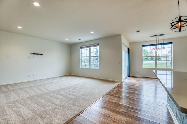 15637 Eddy Creek Way, Apple Valley, MN 55124 - empty room with hardwood / wood-style flooring, baseboards, recessed lighting, and carpet flooring