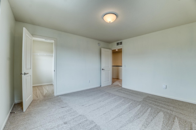 15637 Eddy Creek Way, Apple Valley, MN 55124 - unfurnished bedroom with carpet floors, baseboards, a walk in closet, and a closet