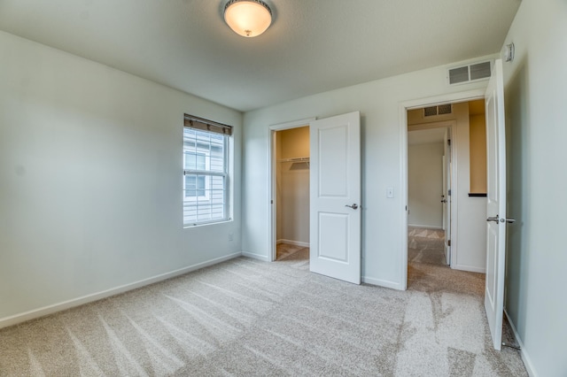 15637 Eddy Creek Way, Apple Valley, MN 55124 - unfurnished bedroom with carpet floors, baseboards, and a walk in closet