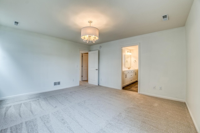 15637 Eddy Creek Way, Apple Valley, MN 55124 - unfurnished bedroom featuring carpet flooring, a chandelier, baseboards, and ensuite bath