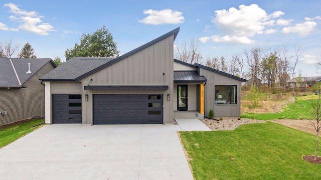 view of front of home featuring a standing seam roof, metal roof, a front yard, a garage, and concrete driveway