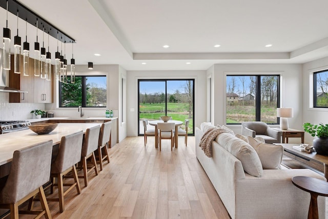 living room with recessed lighting and light wood finished floors