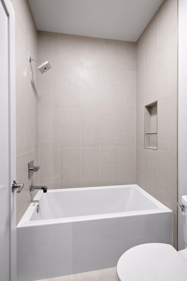bathroom with toilet and  shower combination