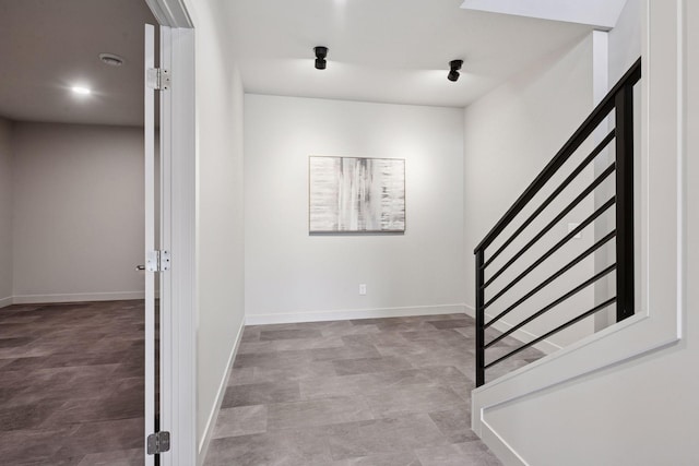 staircase featuring baseboards
