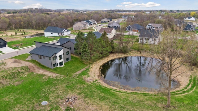drone / aerial view featuring a water view and a residential view
