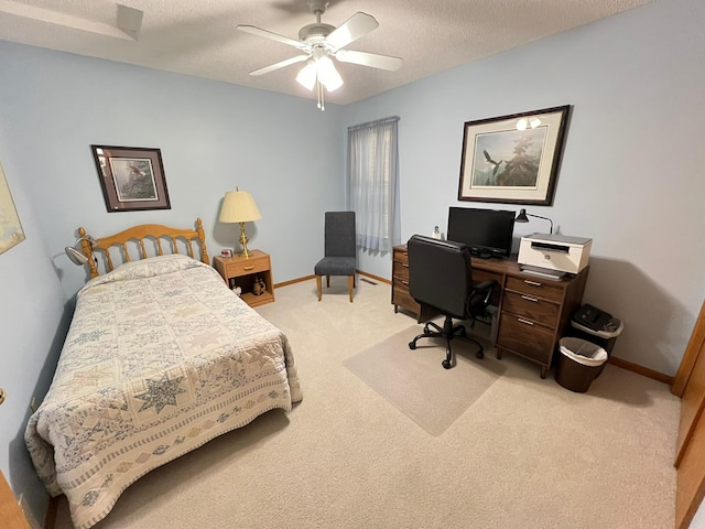 bedroom with a textured ceiling, light carpet, baseboards, and a ceiling fan