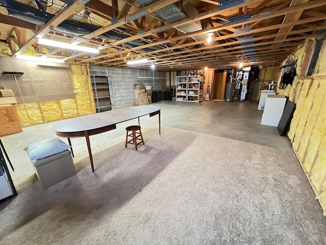 unfinished below grade area featuring washer / dryer