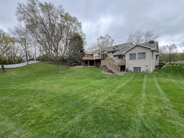 view of yard featuring stairway and a wooden deck