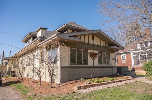 560 7th St, Red Wing, MN 55066 - view of property exterior with board and batten siding and roof with shingles