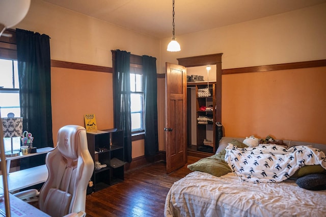 560 7th St, Red Wing, MN 55066 - bedroom with multiple windows, a closet, and wood-type flooring