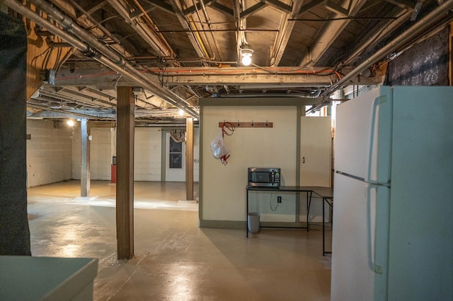 560 7th St, Red Wing, MN 55066 - unfinished basement with freestanding refrigerator