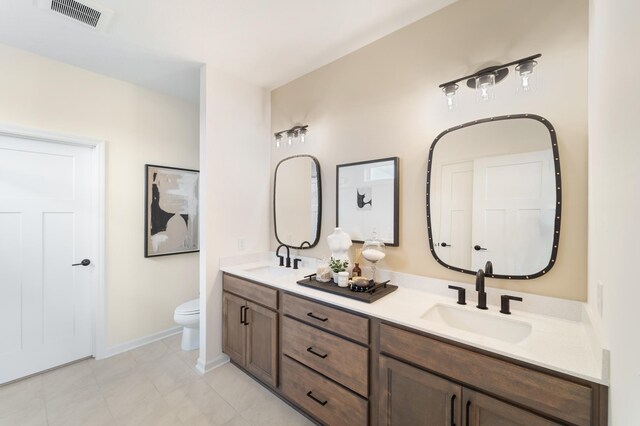 11280 Niagara Ln N, Dayton, MN 55369 - full bathroom with toilet, double vanity, baseboards, and tile patterned floors
